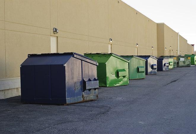 an assortment of sturdy and reliable waste containers near a construction area in Aromas